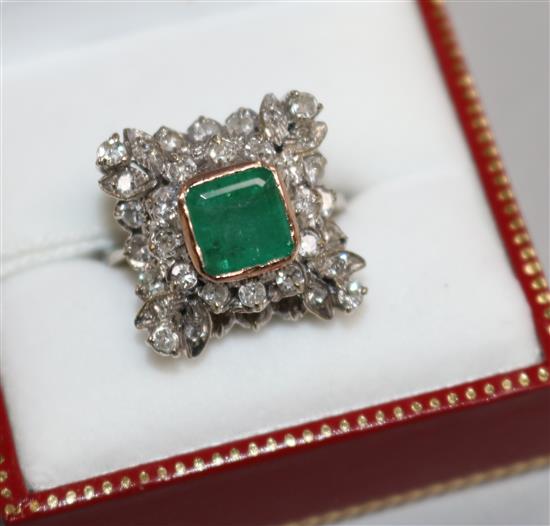 A 19th century style white gold, emerald and diamond cluster ring, size K.